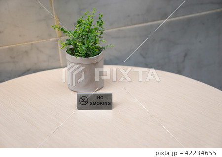 no smoking sign on light wooden table no smoking sign on light wooden table 42234655
