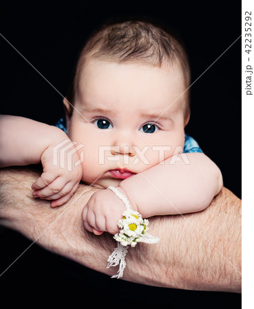 Cute newborn baby girl on his father's hand 42235292