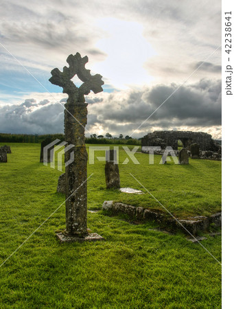 Old celtic stone cross on cemetery Old celtic stone cross on cemetery 42238641