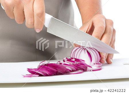 Cook is chopping onion Cook is chopping onion 42241222