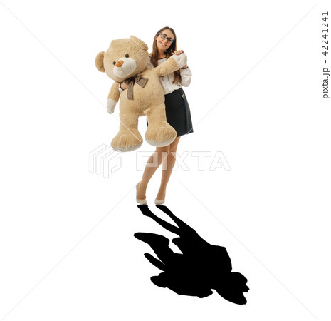 Happy woman waving with huge teddy bear, black shadow Happy woman waving with huge teddy bear, black shadow 42241241