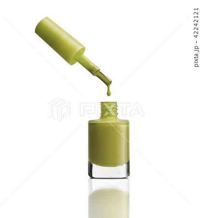 Nail polish dripping from brush into bottle Nail polish dripping from brush into bottle 42242121