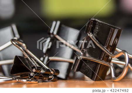 Black Paperclip Put on a wooden table 42247492