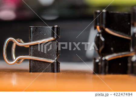 Black Paperclip Put on a wooden table 42247494
