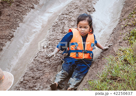 asian child girl having fun to play slider mud 42250637