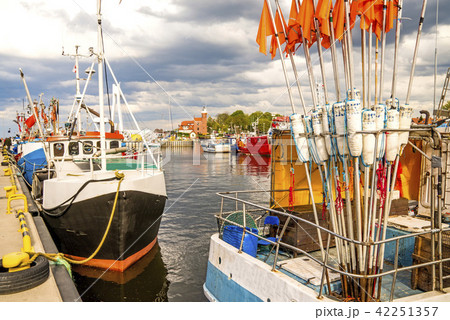 Fishing port of Ustka, Poland with old lighthouse Fishing port of Ustka, Poland with old lighthouse 42251357