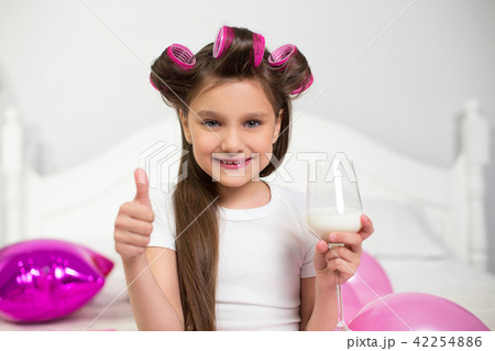 Young girl with wine glass of milk. Young girl with wine glass of milk. 42254886