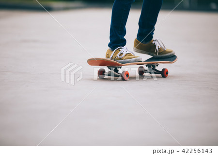 Skateboarder sakteboarding on parking lot Skateboarder sakteboarding on parking lot 42256143