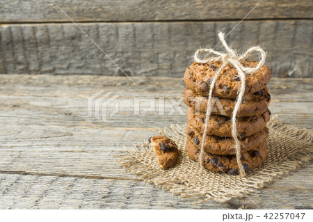 Homemade cookies with chocolate thread tied  42257047