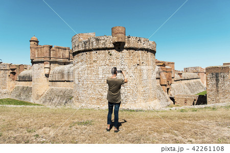 man taking a picture of the Fort de Salses, France 42261108
