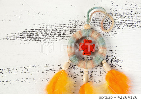 Bright dream catcher with an orange cross 42264126