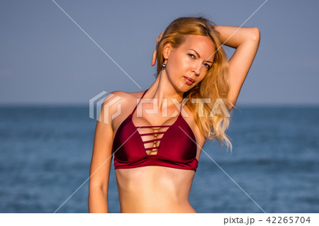 Beautiful girl model on sandy beach 42265704