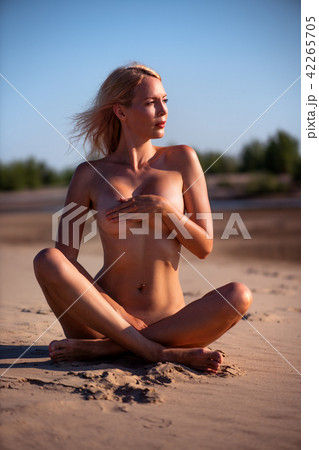 Beautiful girl model on sandy beach of the sea 42265705