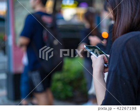 Woman using smartphone in the city 42267198
