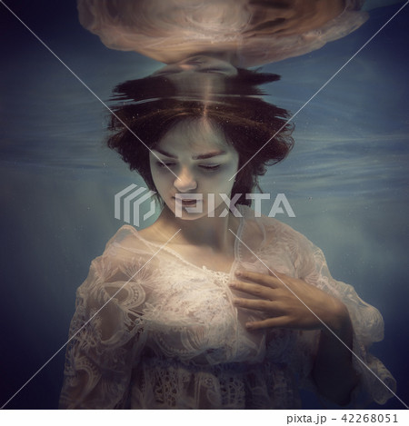 Portrait of a girl in a lace dress under the water Portrait of a girl in a lace dress under the water 42268051