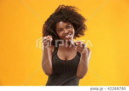 The happy business woman point you and want you, half length closeup portrait on gold background. The happy business woman point you and want you, half length closeup portrait on gold background. 42268780