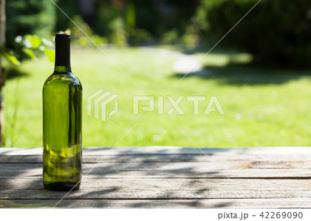 White wine bottle on wooden table White wine bottle on wooden table 42269090