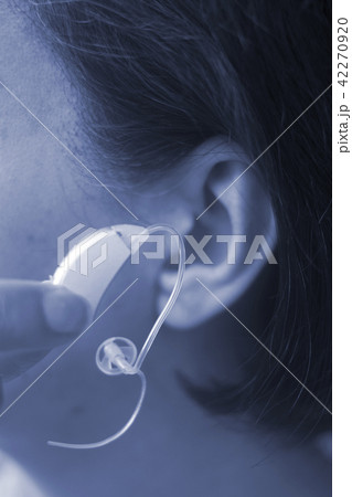 Deaf woman hearing aid ear 42270920