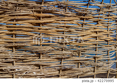 Wicker texture against the blue sky Wicker texture against the blue sky 42270995