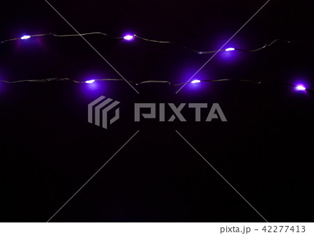 Lamp garlands on a black background 42277413