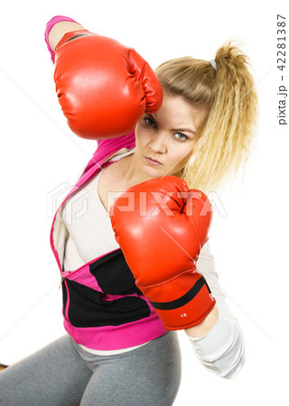 Woman wearing boxing gloves Woman wearing boxing gloves 42281387
