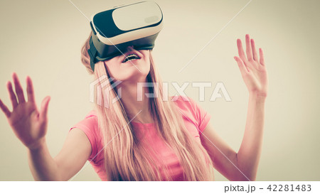 Girl wearing virtual reality goggles. Girl wearing virtual reality goggles. 42281483