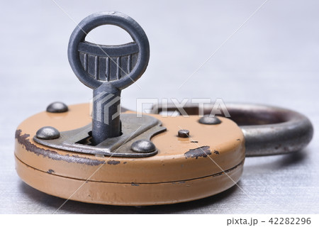 Old rusty padlock with key 42282296