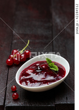 Red fruit jelly with currants in a dish Red fruit jelly with currants in a dish 42284512