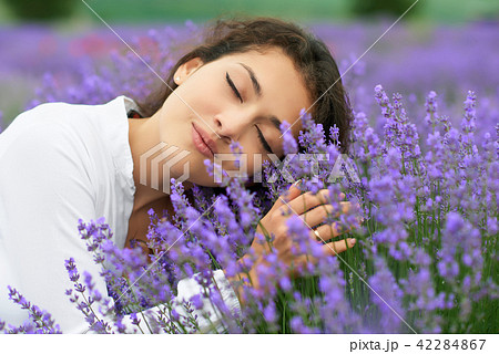 beautiful young woman portrait on lavender flowers beautiful young woman portrait on lavender flowers 42284867