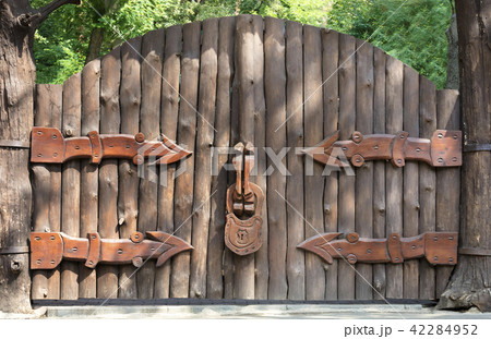 Old and mysterious wooden gate entrance to forest 42284952