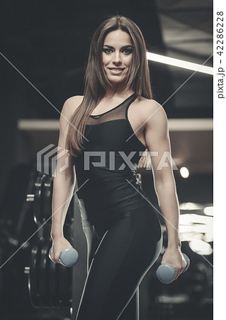Beautiful sexy athletic girl working out in gym 42286228