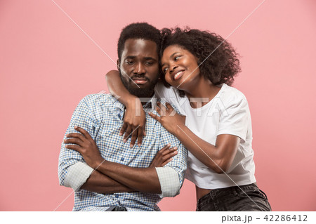 Couple watching sports match on tv at home, celebrating victory, successful game 42286412