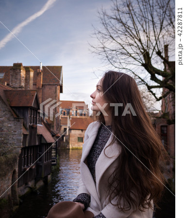 Female tourist inspired by atmosphere of old town Female tourist inspired by atmosphere of old town 42287811