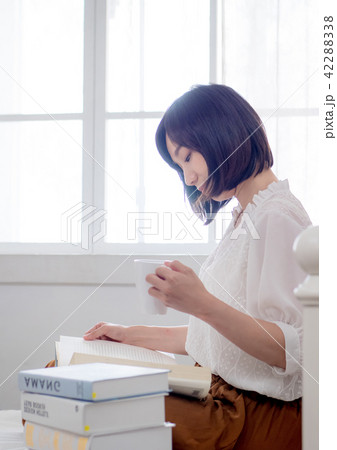 beautiful woman reading a book in morning beautiful woman reading a book in morning 42288338