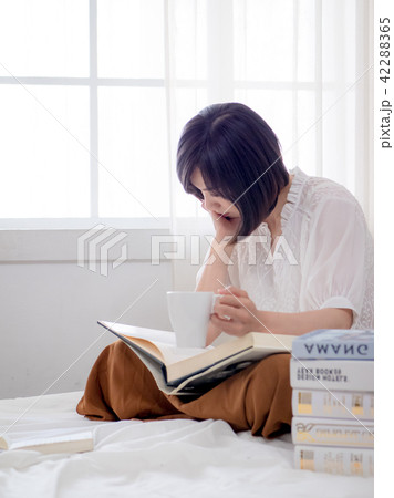 beautiful woman reading a book in morning beautiful woman reading a book in morning 42288365