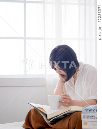 beautiful woman reading a book in morning beautiful woman reading a book in morning 42288374