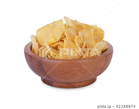 Breakfast cereal cornflakes wooden bowl on white Breakfast cereal cornflakes wooden bowl on white 42288874