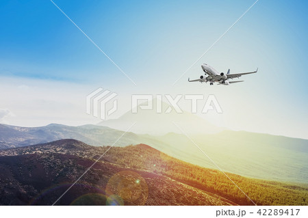 airplane flying sunset sky  travel concept 42289417