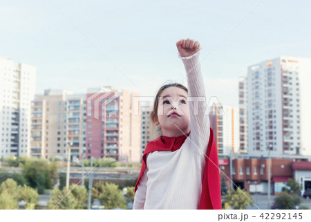 Superhero kid against urban background Superhero kid against urban background 42292145