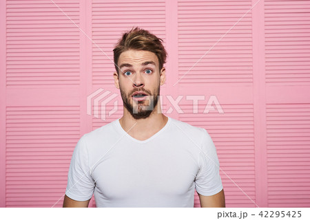 Young handsome man being astonished Young handsome man being astonished 42295425