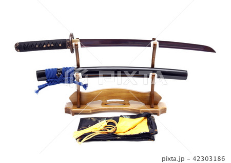 Japanese sword on wooden stand and silk bag Japanese sword on wooden stand and silk bag 42303186