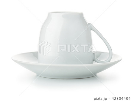 Coffee cup upside down on saucer 42304404
