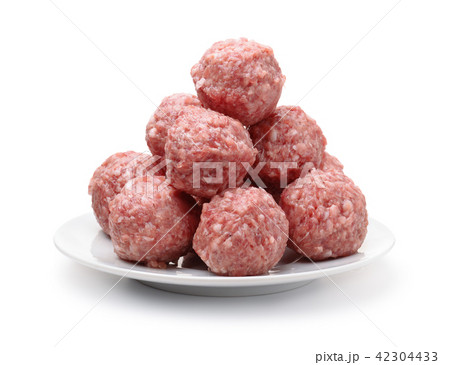 Heap of fresh raw meatballs on plate 42304433
