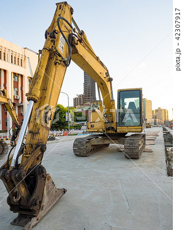 excavator on ground at day excavator on ground at day 42307917