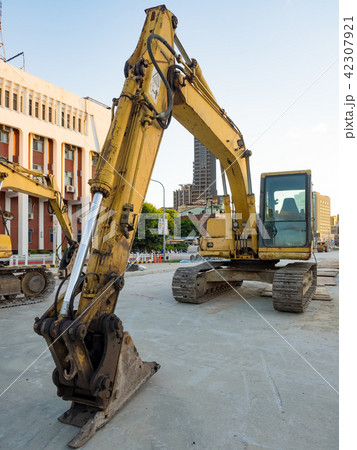 excavator on ground at day excavator on ground at day 42307921