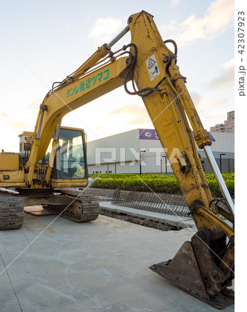 excavator on ground at day 42307923