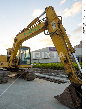 excavator on ground at day 42307925
