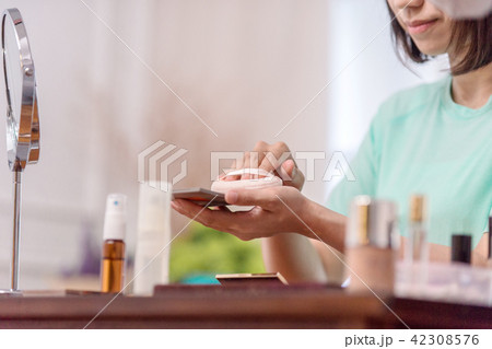 asian women make up her face in room asian women make up her face in room 42308576