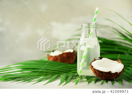 Bottle of coconut water and fresh ripe fruits on 42309971