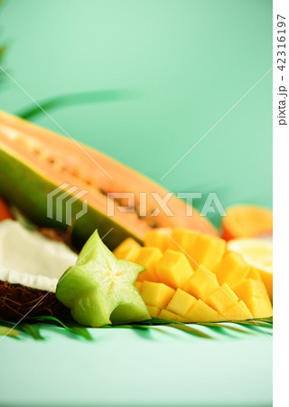 Assortment of exotic fruits on turquoise Assortment of exotic fruits on turquoise 42316197